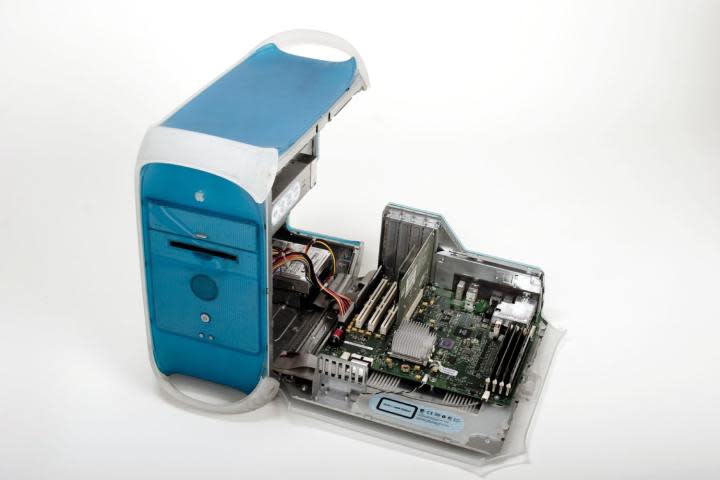 The Apple Power Mac G3 Blue and White against a white background, with its side panel open.