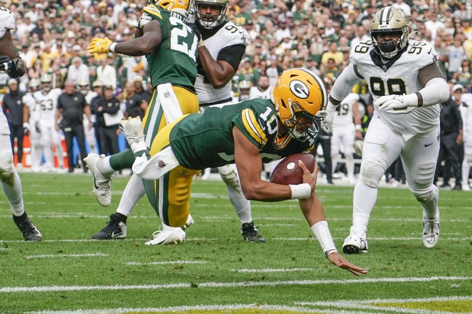 Green Bay Packers quarterback Jordan Love (10) dives into the end zone on a touchdown carry during the second half of an NFL football game against the New Orleans Saints Sunday, Sept. 24, 2023, in Green Bay, Wis. | Morry Gash, Associated Press