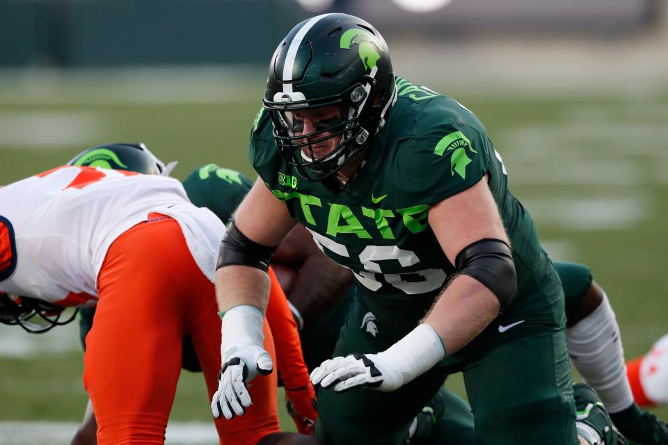 In this file photo, Michigan State guard Matt Carrick blocks during the first half of a game against Illinois, in East Lansing on Nov. 9, 2019. After missing the final six games of last season as well as all of spring practice, Carrick is set to return to the field when the Spartans began preseason camp next week.