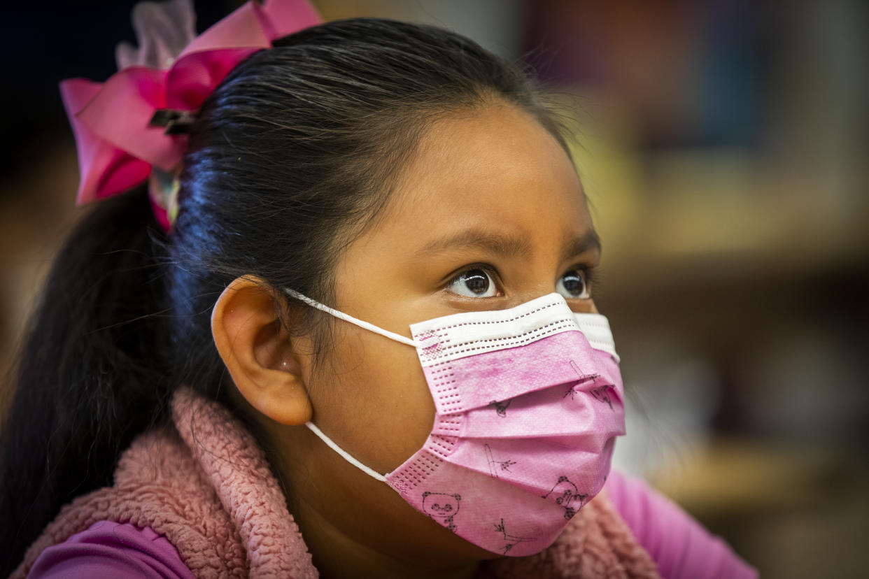 Los Angeles, CA - August 16:  A third grade dual language student wears a mask as she listens to instruction while Los Angeles Unified Interim Superintendent Megan K. Reilly, teachers, principals, school site employees visit on the first day of school at Los Angeles Unified School District at Montara Avenue Elementary School on Monday, Aug. 16, 2021 in Los Angeles, CA.  Los Angeles Unified Interim Superintendent Megan K. Reilly, Board Members and special guests celebrate the first day of instruction on August 16, welcoming students, teachers, principals, school site employees and families, while visiting special programs and classrooms at each site. (Allen J. Schaben / Los Angeles Times via Getty Images)