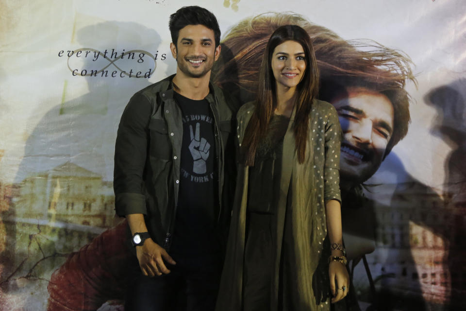 Bollywood actors Sushant Singh Rajput, left, and Kriti Sanon pose for photographs during a press conference to promote their upcoming movie "Raabta" in Ahmadabad, India, Tuesday, May 30, 2017. The film is scheduled to be released on June 9. (AP Photo/Ajit Solanki)