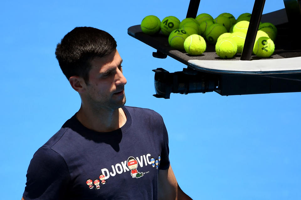 Novak Djokovic of Serbia takes a break during a practice session ahead of the Australian Open at the Melbourne Park tennis centre in Melbourne on January 12, 2022. - - -- IMAGE RESTRICTED TO EDITORIAL USE - STRICTLY NO COMMERCIAL USE -- (Photo by William WEST / AFP) / -- IMAGE RESTRICTED TO EDITORIAL USE - STRICTLY NO COMMERCIAL USE -- (Photo by WILLIAM WEST/AFP via Getty Images)