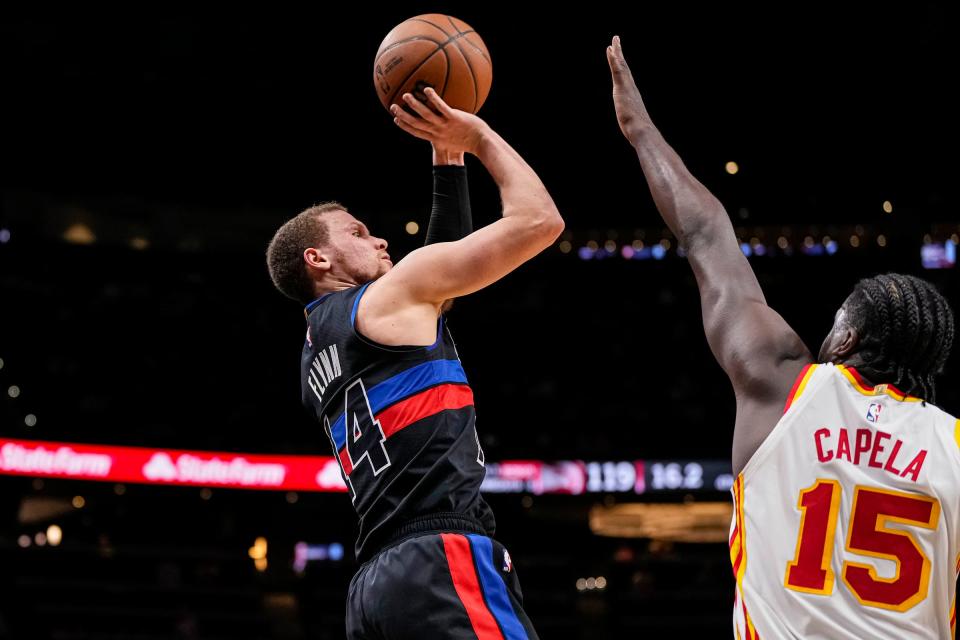 Pistons guard Malachi Flynn shoots over Hawks center Clint Capela during the second half during the Pistons' 121-113 loss on Wednesday, April 3, 2024, in Atlanta.
