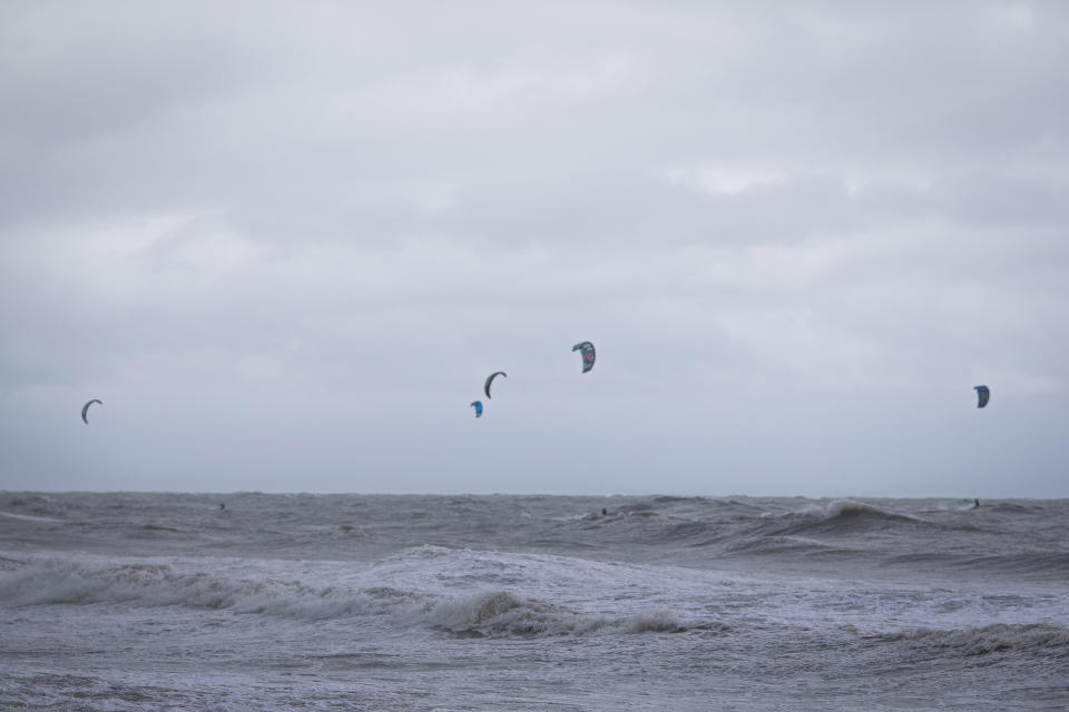 Several kiteboarders brave the storm surge of Tropical Storm Ophelia on Saturday, Sept. 23, 2023, at the Virginia Beach oceanfront, in Virginia Beach, Va. (AP Photo/John C. Clark)