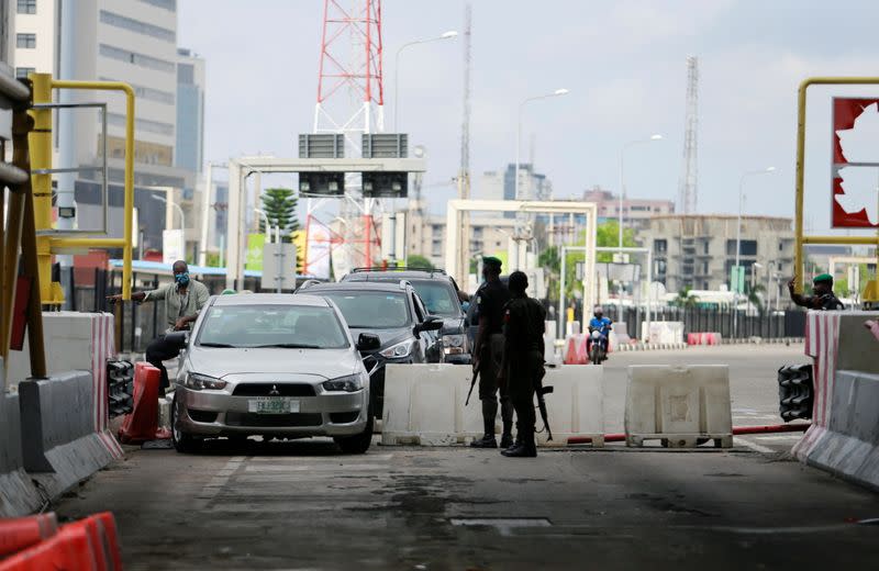 Cars drive through the Lekki toll gate in Lagos