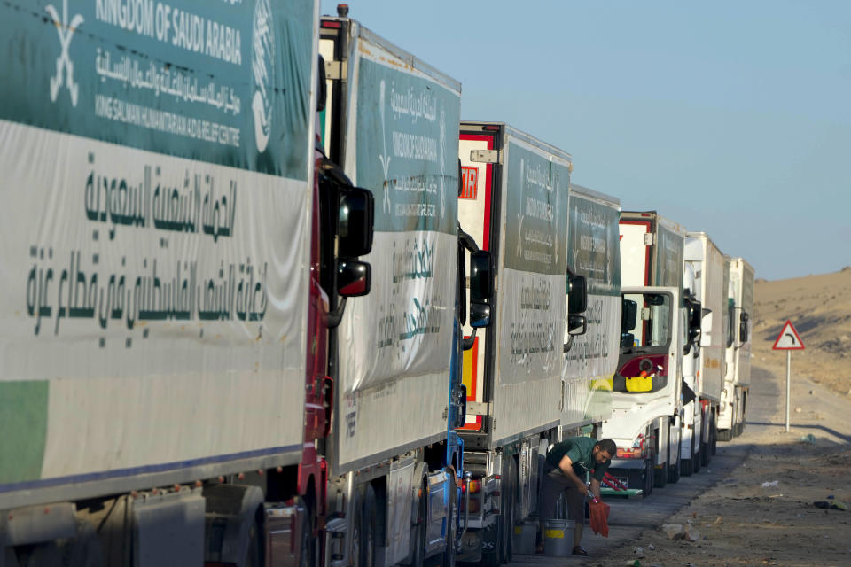 Trucks carrying humanitarian aid from King Salman humanitarian aid and relief center (KSrelief), line up as they prepare to cross Rafah crossing port to Gaza Strip, Wednesday, Nov. 29, 2023. (AP Photo/Amr Nabil)