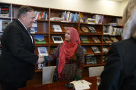 Secretary of State Mike Pompeo, left, shakes hands with Zarghona Baloch, a women's rights activist, as he meets with representatives from Afghan civil society, Tuesday, June 25, 2019, during an unannounced visit to Kabul, Afghanistan. (AP Photo/Jacquelyn Martin, Pool)