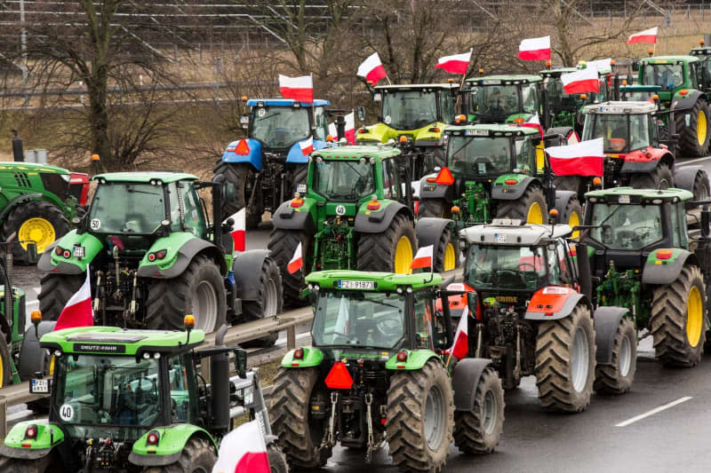 Polish farmers with their tractors and vehicles block the expressway S3 during a protest against EU climate policies and cheap Ukrainian agricultural products imports. Karol Serewis/SOPA Images via ZUMA Press Wire/dpa