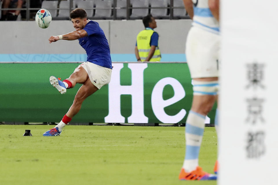 FILE - In this Saturday, Sept. 21, 2019 file photo, France's Romain Ntamack, kicks a conversion during the Rugby World Cup Pool C game at Tokyo Stadium between France and Argentina in Tokyo, Japan. Flyhalf Ntamack, the son of Emile Ntamack who played 46 times for France and is equal fifth on its all-time try scorers' list, is tipped to start Sunday's quarterfinal against Wales, 20 years after his father played the final. (AP Photo/Eugene Hoshiko,File)