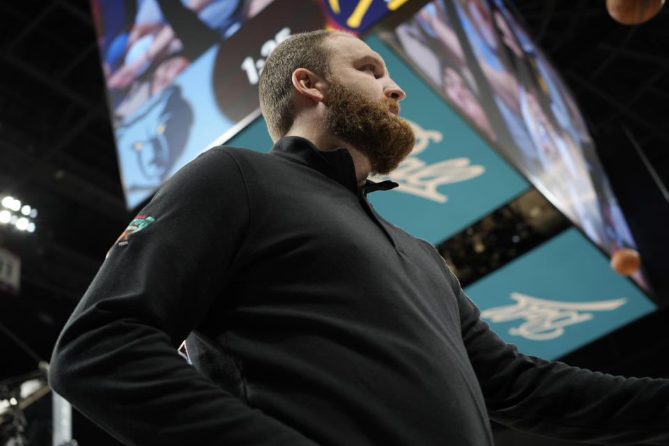 Memphis Grizzlies coach Taylor Jenkins watches during the first half of the team's NBA basketball game against the Denver Nuggets on Friday, Jan. 21, 2022, in Denver. (AP Photo/David Zalubowski)