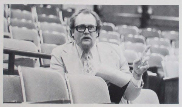 An undated picture shows Wayne "Hank" Hansen sitting in the auditorium of the former Ames High School in the 1970s. The school's new performing art center will be dedicated in his honor Saturday.