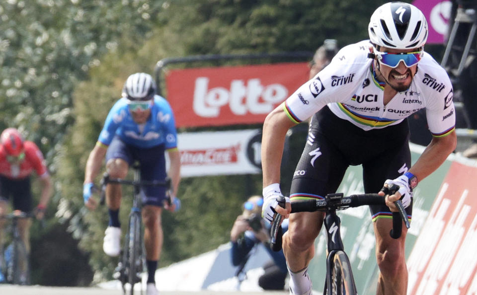 France's Julian Alaphilippe of the Deceuninck Quick-Step team sprints to the finish line to win the Belgian cycling classic and UCI World Tour race Fleche Wallonne, in Huy, Belgium, Wednesday, April 21, 2021. (AP Photo/Olivier Matthys)