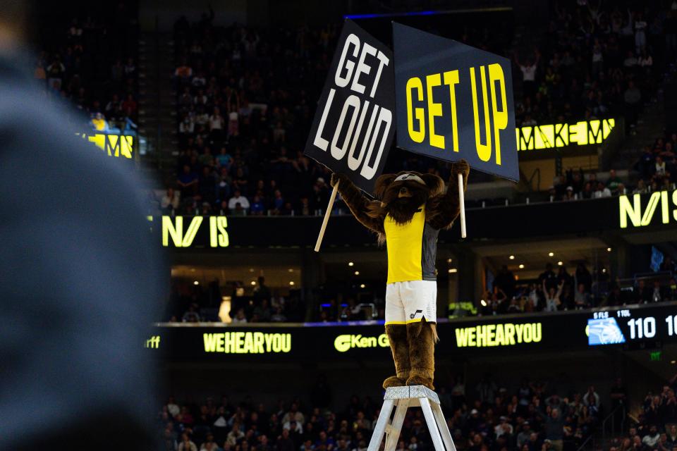 Jazz Bear holds up signs telling the audience to get up and get loud during the final quarter of an NBA basketball game between the Utah Jazz and Orlando Magic at the Delta Center in Salt Lake City on Thursday, Nov. 2, 2023. | Megan Nielsen, Deseret News
