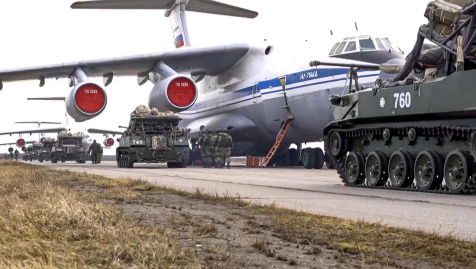 FILE - In this April 22, 2021, file photo provided by Russian Defense Ministry Press Service, Russian military vehicles prepare to be loaded into a plane for airborne drills during maneuvers in Crimea. Earlier this year, Russia bolstered its forces near Ukraine and warned Kyiv that it could intervene militarily if Ukrainian authorities try to retake the rebel-controlled east. Moscow also has bristled at NATO’s joint drills with Ukraine, saying they reflect the alliance’s aggressive intentions. (Russian Defense Ministry Press Service via AP, File)