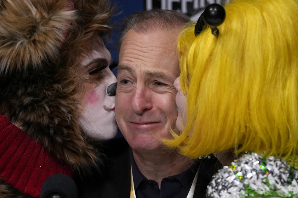 Actor Bob Odenkirk is kissed during a a news conference after being honored as Man of the Year by Harvard University's Hasty Pudding Theatricals, Thursday, Feb. 2, 2023, in Cambridge, Mass. (AP Photo/Charles Krupa)