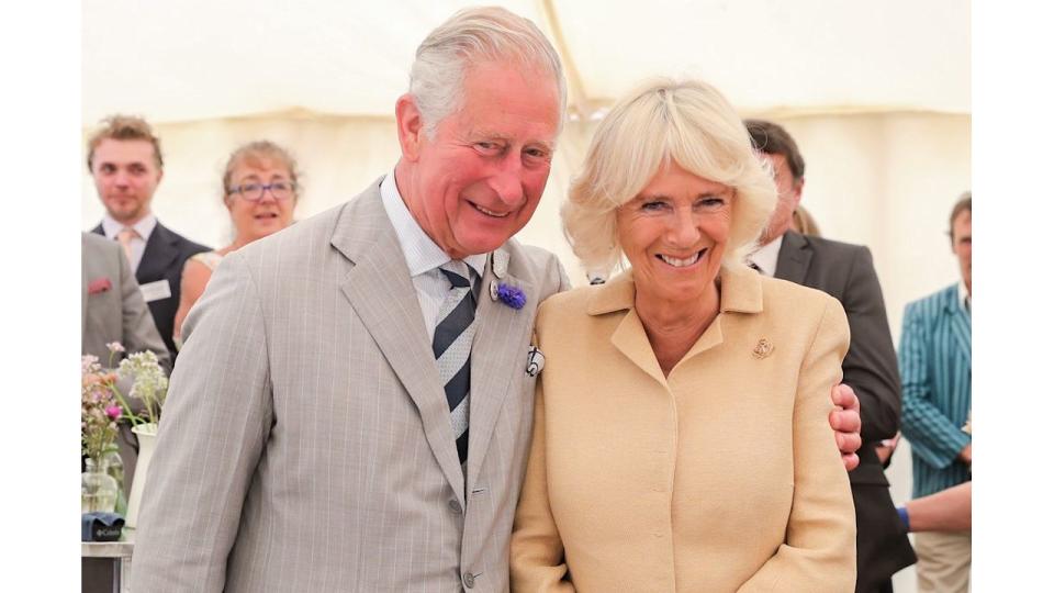 Charles puts his arm around Camilla on her birthday