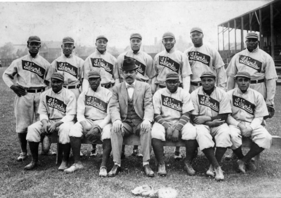 Team portrait of the Chicago Leland Giants baseball team, of the Negro League, with manager and owner Frank Leland (seated center, in the business suit), Chicago, Illinois, 1907. Among those also pictured are Rube Foster (standing far right) and Pete Hill (standing far left). (Photo by Transcendental Graphics/Getty Images)