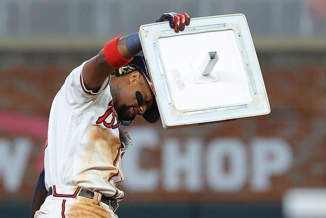 Dansby Swanson of the Atlanta Braves after sliding into third during  News Photo - Getty Images