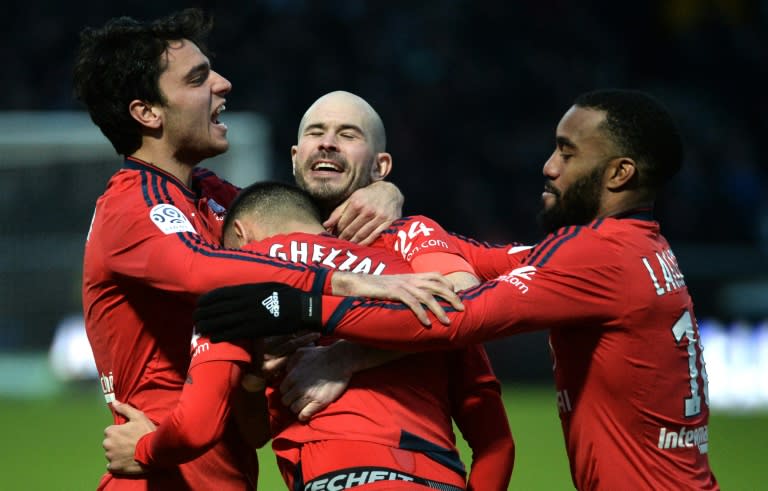 Lyon's Rachid Ghezzal (2rd L) celebrates with Clement Grenier (L), Christophe Jallet (M) and Alexandre Lacazette during the French L1 football match between Angers and Lyon, on February 6, 2016, in Jean Bouin Stadium, in Angers, France