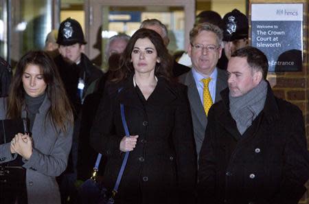 Celebrity chef Nigella Lawson (C) leaves Isleworth Crown Court in west London December 4, 2013. REUTERS/Neil Hall