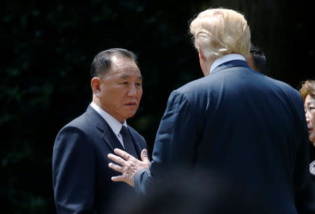 North Korea's envoy Kim Yong Chol talks with U.S. President Donald Trump as he departs after a meeting at the White House in Washington, U.S., June 1, 2018. REUTERS/Leah Millis