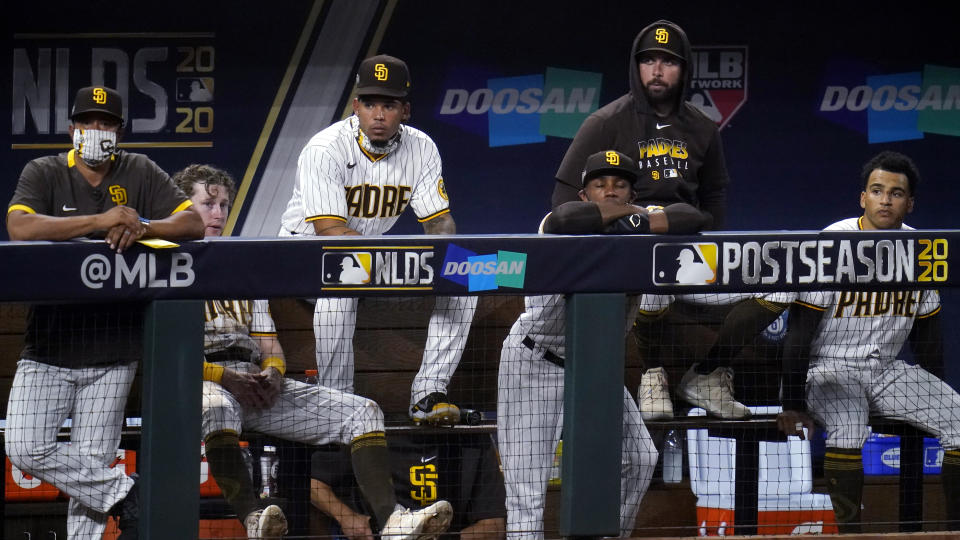 San Diego Padres watch play while trailing the Los Angeles Dodgers during the sixth inning in Game 3 of a baseball National League Division Series Thursday, Oct. 8, 2020, in Arlington, Texas. (AP Photo/Sue Ogrocki)