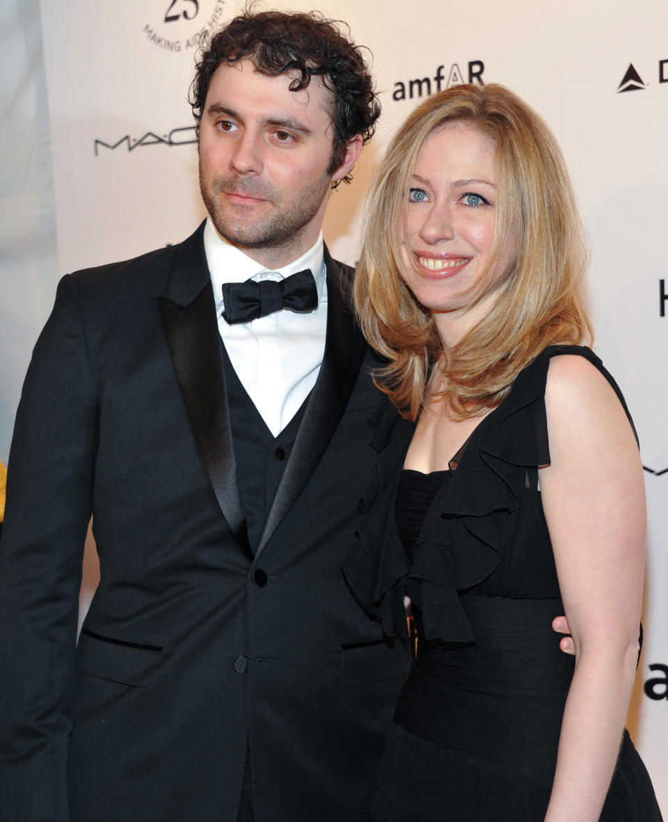 FILE- In this Feb. 9, 2011 photo, Chelsea Clinton and her husband Marc Mezvinsky attend amfAR's annual New York Gala at Cipriani Wall Street in New York. Clinton announced that she is pregnant with the couple’s first child on Thursday, April 17, 2014 while co-hosting a Clinton Foundation event with her mother, Former Secretary of State Hillary Rodham Clinton. (AP Photo/Evan Agostini, File)