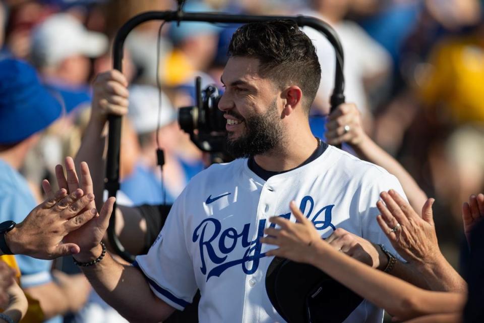 Former Kansas City Royals first baseman Eric Hosmer high-fives fans as he walks onto the field for a pre-game ceremony honoring the club’s 2014 American League champions at Kauffman Stadium on Friday, May 17, 2024.