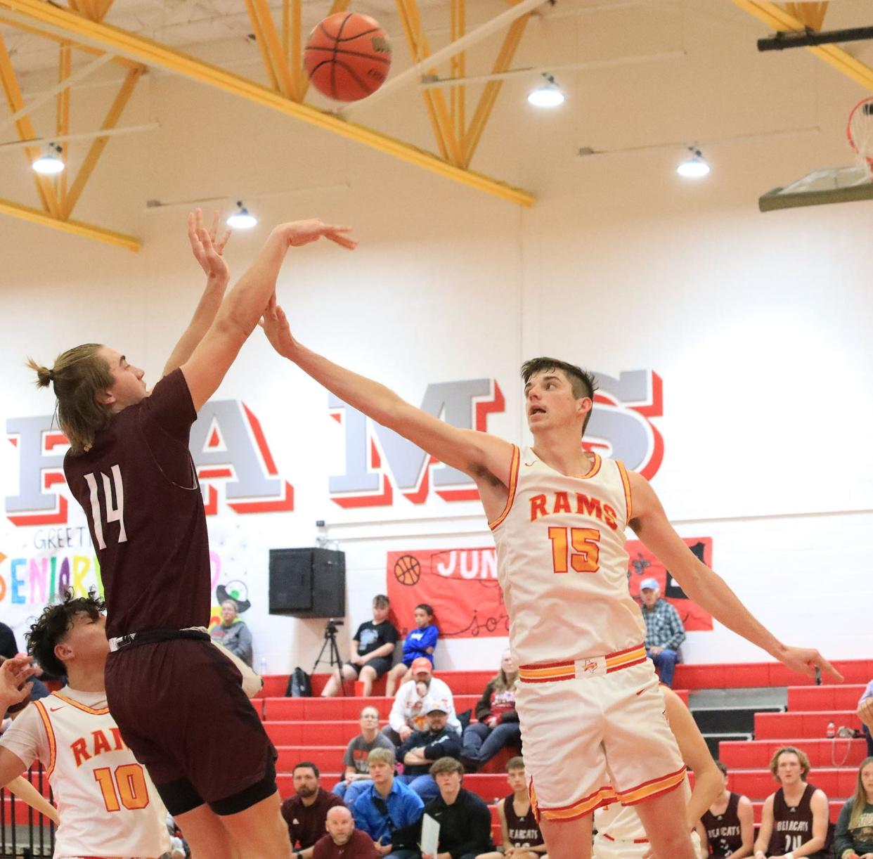 Whitesboro's Jake Hermes, who scored 19 points, shoots over S&S' Eli Mahan during District 10-3A action.