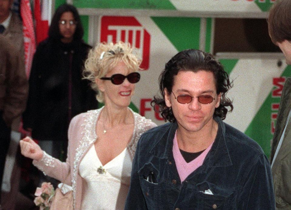 Bono’s relationship ended with Paula Yates and Michael Hutchence (both pictured) after he became disturbed by their excessive drug use and declined to be be godparent to their daughter, Tiger Lily (PA)