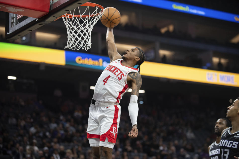 Houston Rockets guard Jalen Green (4) scores against the Sacramento Kings during the first quarter of an NBA basketball game in Sacramento, Calif., Friday, Jan. 13, 2023. (AP Photo/José Luis Villegas)