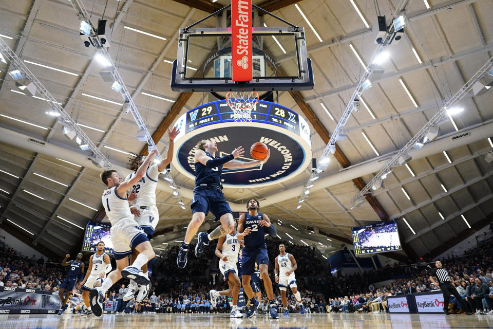 Xavier's Adam Kunkel goes up for a shot during the first half of an NCAA college basketball game against Villanova, Saturday, Jan. 7, 2023, in Villanova, Pa. (AP Photo/Matt Slocum)