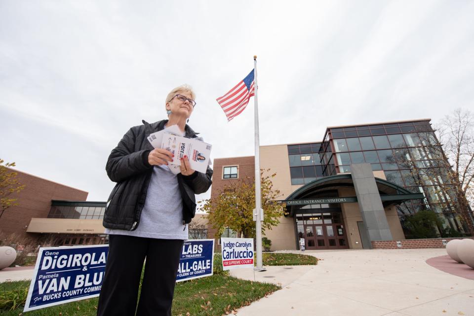 Laura Siena, a campaign volunteer, stands outside Tohickon Middle School, in Plumstead, during the general elections on Tuesday, Novemeber 7, 2023.