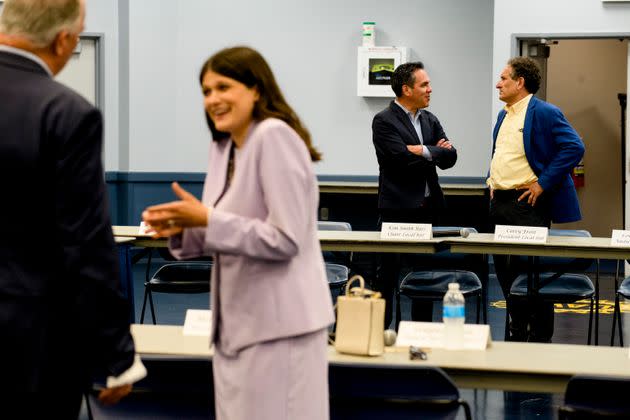 Rep. Haley Stevens (D-Mich.), foreground, talks with Rep. Dan Killdee (D-Mich.) at a UAW panel on Friday. Her opponent, Rep. Andy Levin (D-Mich.), background right, speaks to House Democratic Caucus Vice Chair Pete Aguilar (D-Calif.). (Photo: Brittany Greeson for HuffPost)