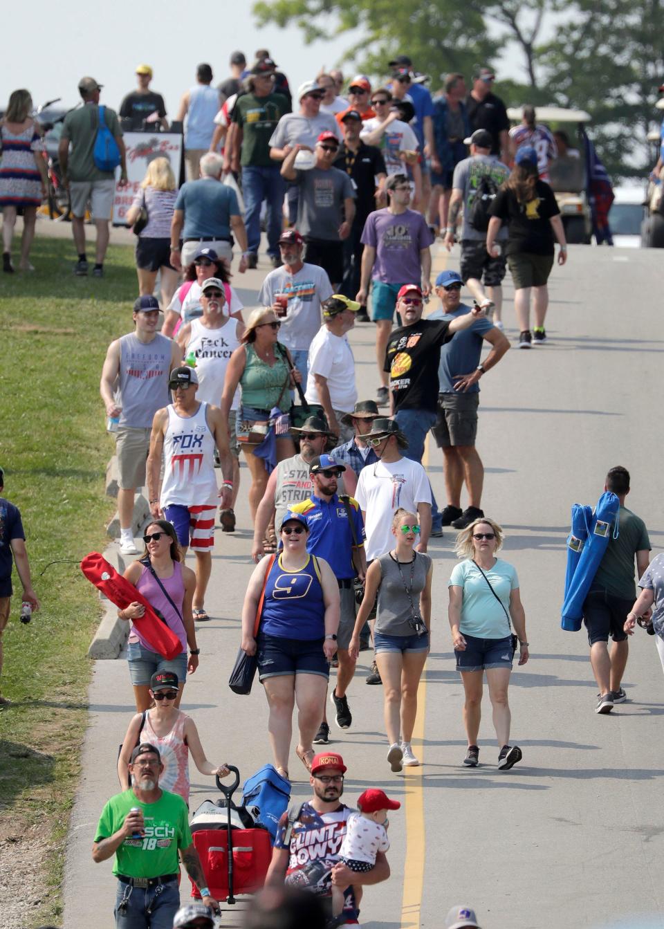 NASCAR fans fill the walkway near the Gear Box concession stand before the Cup Series race at Road America last Fourth of July.