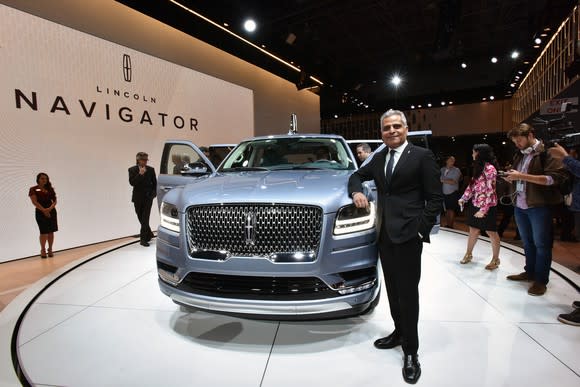 Kumar Galhotra standing next to a 2018 Lincoln Navigator SUV on Lincoln's stand at the 2017 New York International Auto Show.