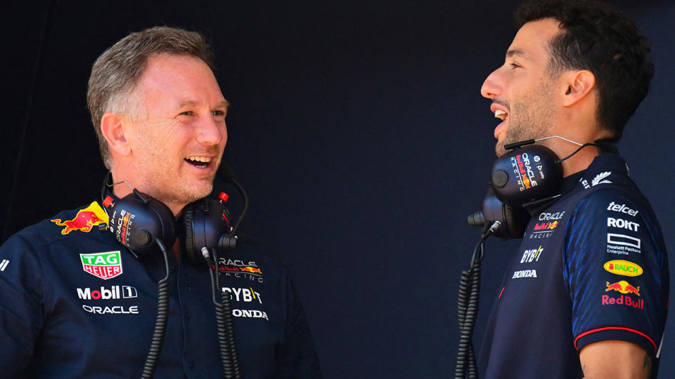 Christian Horner talks with Daniel Ricciardo.