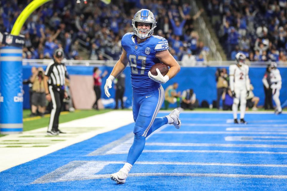 Detroit Lions tight end Sam LaPorta (87) makes a catch for a touchdown against Denver Broncos safety P.J. Locke (6) during the second half at Ford Field in Detroit on Saturday, Dec. 16, 2023.