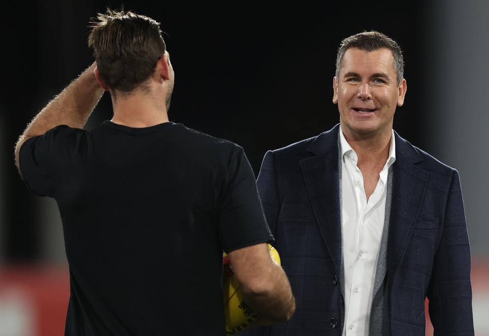 Wayne Carey, pictured here speaking to Tom Hawkins before the Geelong Cats' clash with Melbourne Demons.