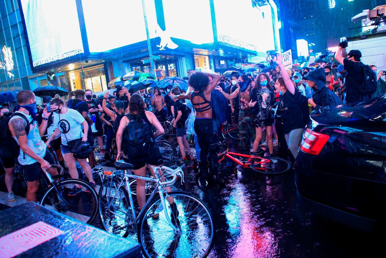 A Black Lives Matter protest in New York's Times Square saw demonstrators hit with a car: AFP via Getty Images