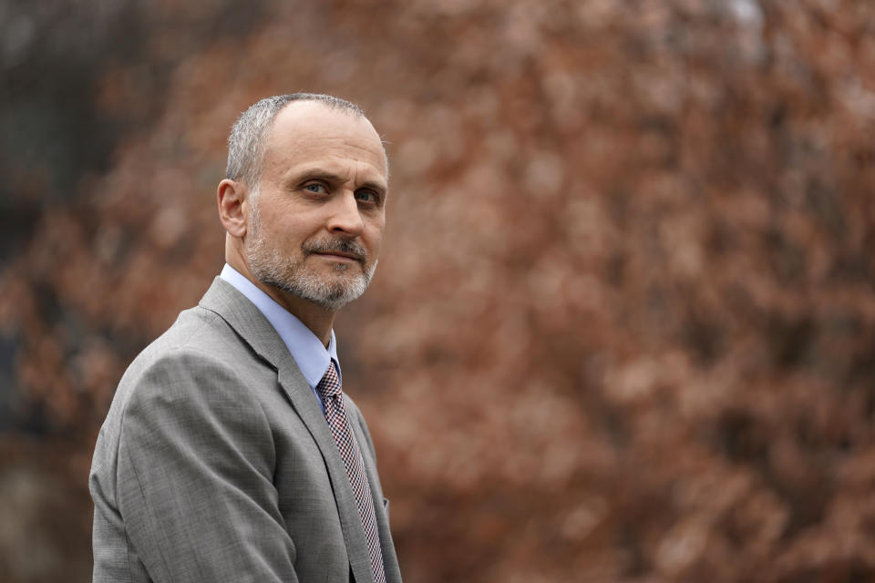 Kenneth Trzaska, President of Lewis & Clark Community College, poses for a photo on the college's campus Dec. 15, 2021, in Godfrey, Ill. The small Illinois school canceled classes for days after a ransomware attack last month that knocked critical computer systems offline. (AP Photo/Jeff Roberson)