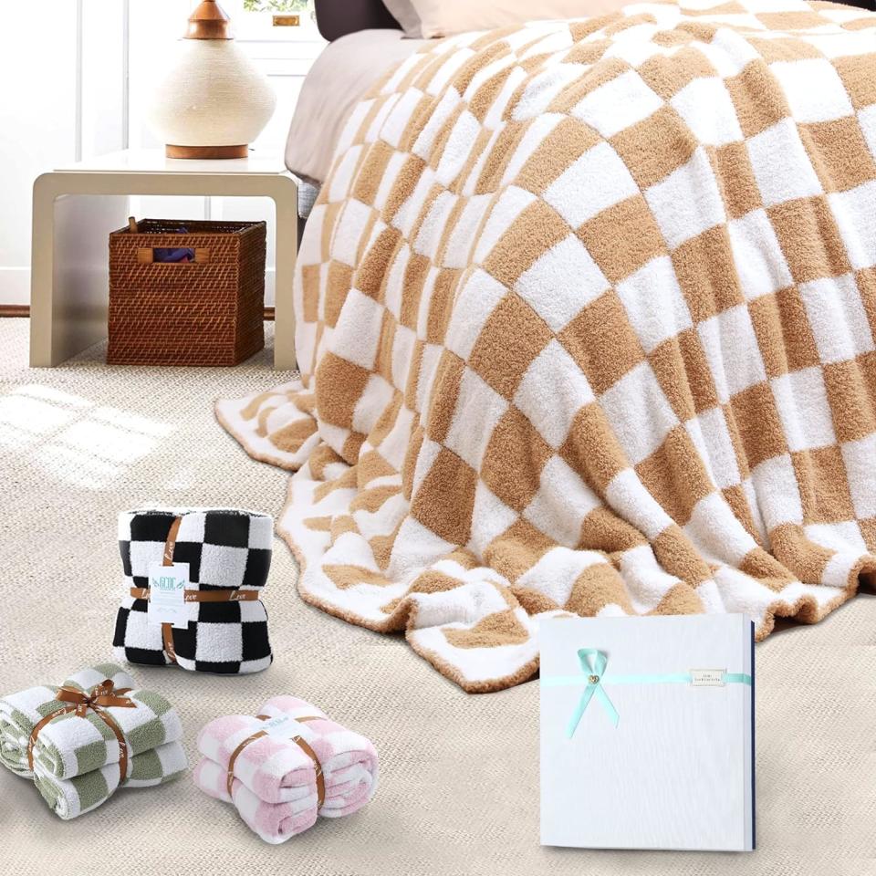 brown and white checkered blanket on bed