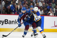 St. Louis Blues center Brayden Schenn (10) collides with Colorado Avalanche center Nathan MacKinnon (29) during the first period in Game 2 of an NHL hockey Stanley Cup second-round playoff series Thursday, May 19, 2022, in Denver. (AP Photo/Jack Dempsey)