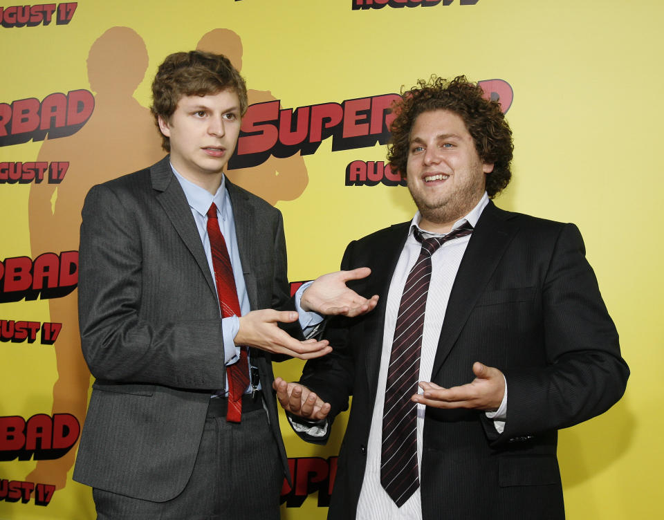 Cast members Michael Cera (L) and Jonah Hill pose at the premiere of 