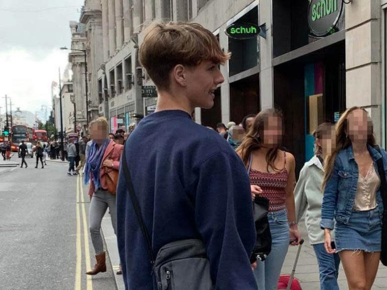 A primary school teacher has described being shoved in front of a double-decker bus by a teenage boy after she told him off for spitting at her niece.Geraldine Lynne said she was left lying in the middle of Oxford Street, London, in the path of the vehicle after she confronted a boy and a girl outside a River Island store at 2.45pm on Saturday 15 June.The Metropolitan Police has released an image of the boy today, which was taken by Ms Lynne moments before he attacked her and fled into Oxford Circus Tube station.Ms Lynne said she and her niece were shopping when the boy and girl repeatedly stepped on her niece’s shoe heels.“My niece turned round and asked them to stop and I told the two teens to walk in front of us. I assumed it was an accident,” Ms Lynne told the Evening Standard.“A few moments later, I heard them say, ‘Three, two, one’ and with that he spat at my niece. I was really shocked.”After she approached the boy to take a photo of him, Ms Lynne said he became “aggressive” and pushed her with both hands in front of a bus, which – fortunately for her – had stopped in traffic.“I’m horrified to consider what might’ve happened if a 12-and-a-half tonne bus had run over me,” she said.“It’s just so violent … it was frightening to think one small incident can escalate into being pushed in front of a bus.”Police are appealing for anyone who recognises the suspect, who was thought to be wearing a blue Nike sweatshirt and had a silver stud in his right ear, to contact them on 101 and quote CAD4070/15Jun.Alternatively, anyone who recognises him can contact Crimestoppers anonymously on 0800 555 111.