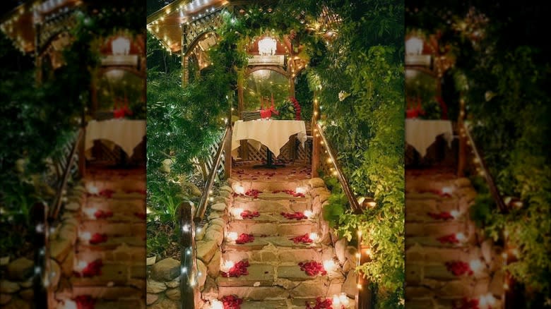 Steps with rose petals greenery