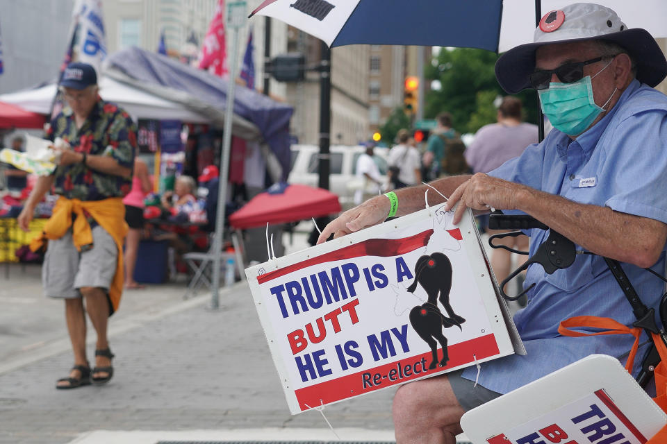 TULSA, OK - JUNE 20: A Donald Trump supporter holds a sign in support prior to a campaign rally for President Donald Trump at the BOK Center on June 20, 2020 in Tulsa, Oklahoma. Trump is scheduled to hold his first political rally since the start of the coronavirus pandemic at the BOK Center on Saturday while infection rates in the state of Oklahoma continue to rise. (Photo by Michael B. Thomas/Getty Images)