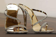 British jewelry designer Christopher Michale Shellis created a pair of solid gold, diamond encrusted heels worth an estimated $229,169. "The aim of this was to create a unique form of jewelry which you can wear on your feet," the designer told the <i>UK Telegraph</i>. "It's a bit like if you found these on an archaeological dig in thousands of years time they would be regarded as a treasure."