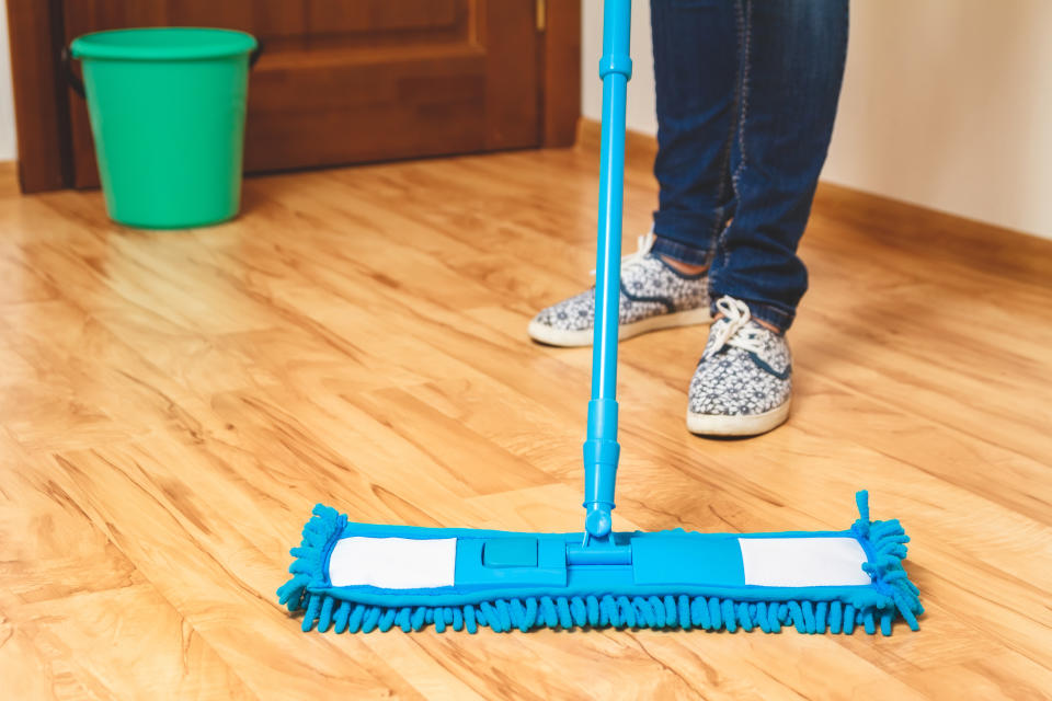 Wood floor being mopped