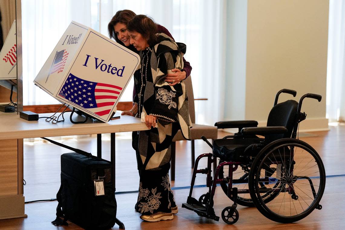 Republican presidential candidate former UN Ambassador Nikki Haley helps her mother Raj Kaur Randhawa vote Saturday, Feb. 24, 2024, in Kiawah Island, S.C. (AP Photo/Chris Carlson) Chris Carlson/AP